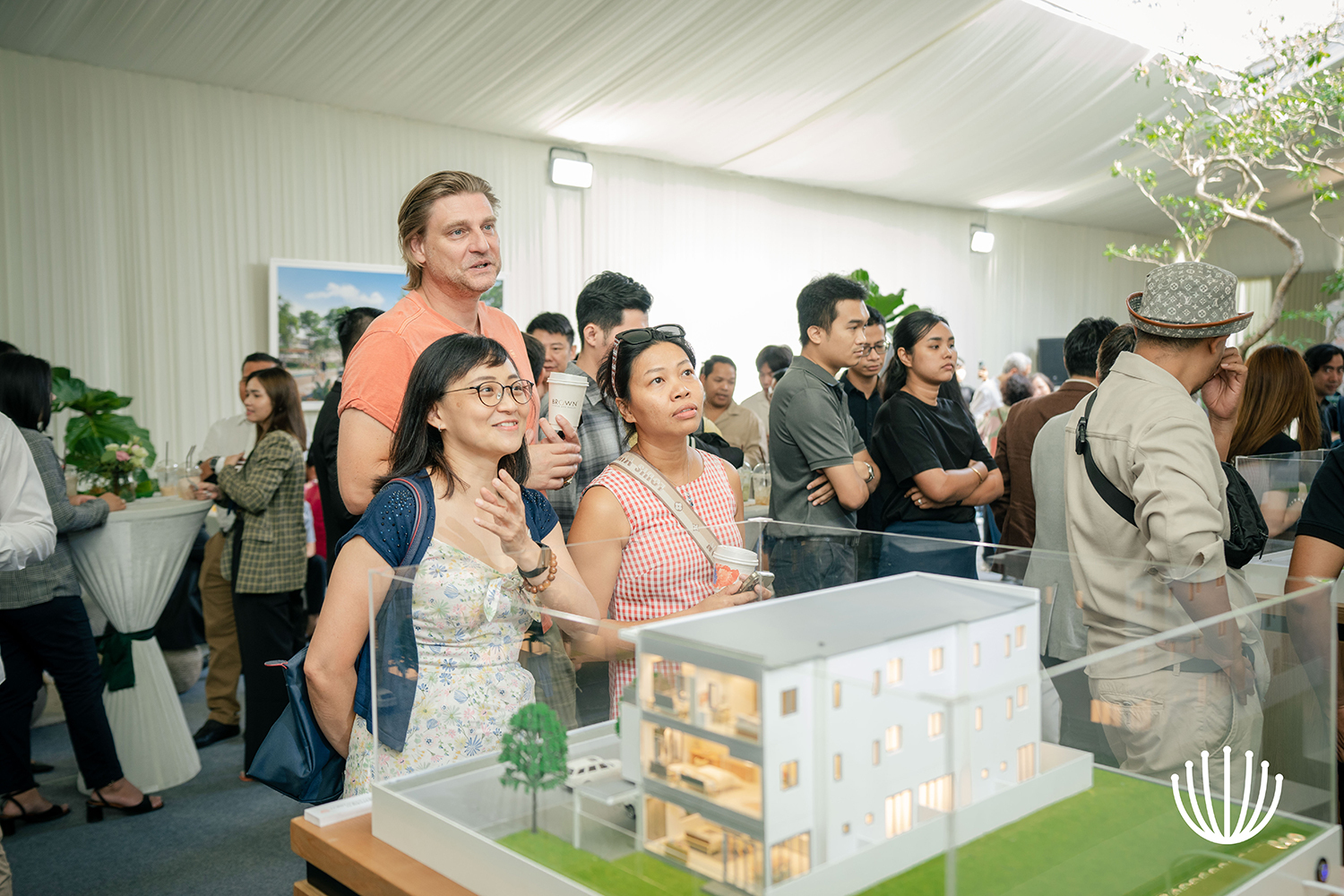 [Respected guests looking at the image and house model of Borey Chankiri 2]